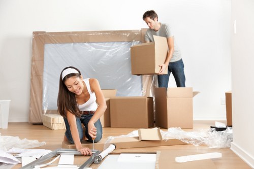 Professional movers handling large furniture pieces near Hampton homes