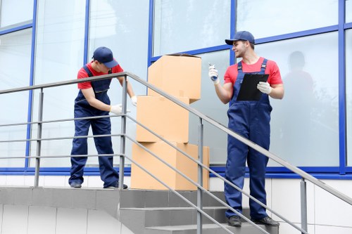 Staff using protective equipment during a removal task