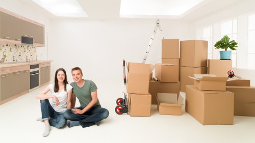 Commercial moving team handling office furniture and equipment