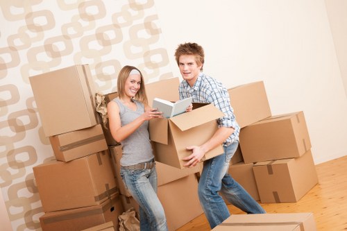 Workers assessing moving risks before loading items into a van