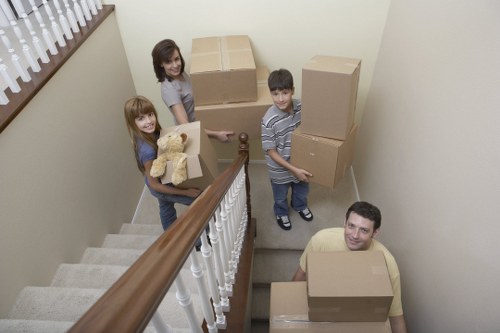 Professional movers loading office equipment for a Hampton business move